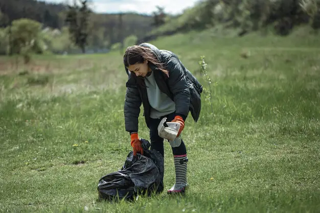 girl-volunteer-collects-garbage-forest-takes-care- Residential pet waste collection service for clean and odor-free yards